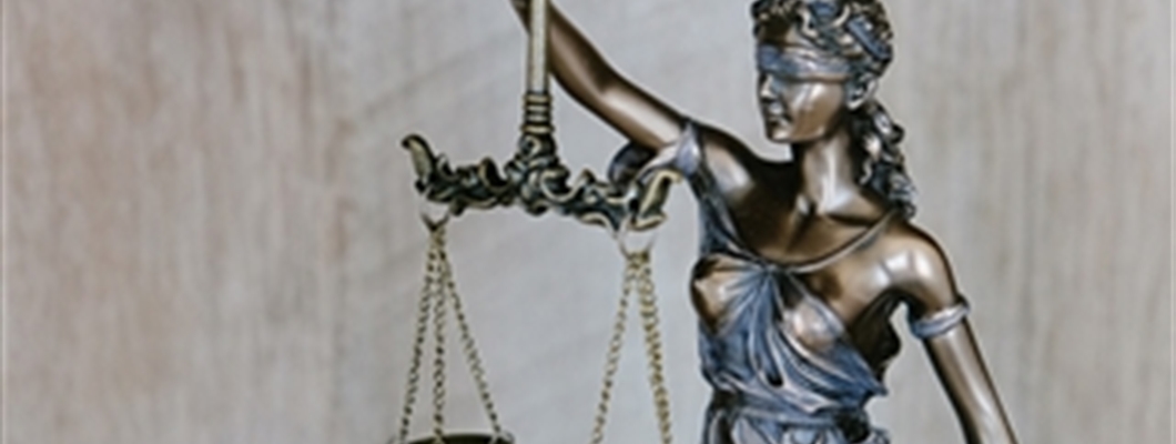 Bronze statue holding scales