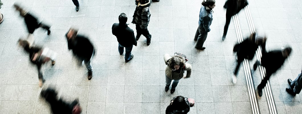 People commuting through a train station