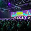 Photo of a packed conference room at the CIPD's Annual Conference in Manchester. The Audience are watching Peter Cheese talk and he is also on screen. 