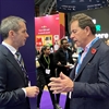 A picture of the CIPD's Chief Executive, Peter Cheese talking to a man at the CIPD's Annual Conference and Exhibition in Manchester.